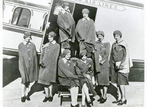 Airline stewardesses gather for a photograph
