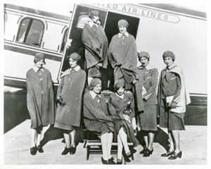 Airline stewardesses gather for a photograph