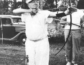 Photo of Max Ehrmann shooting a bow and arrow