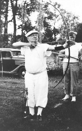 Photo of Max Ehrmann shooting a bow and arrow